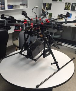 A small Unmanned Aerial Vehicle sitting on a table
